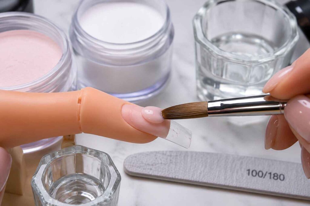 acrylic nail application with brush and polymer powder